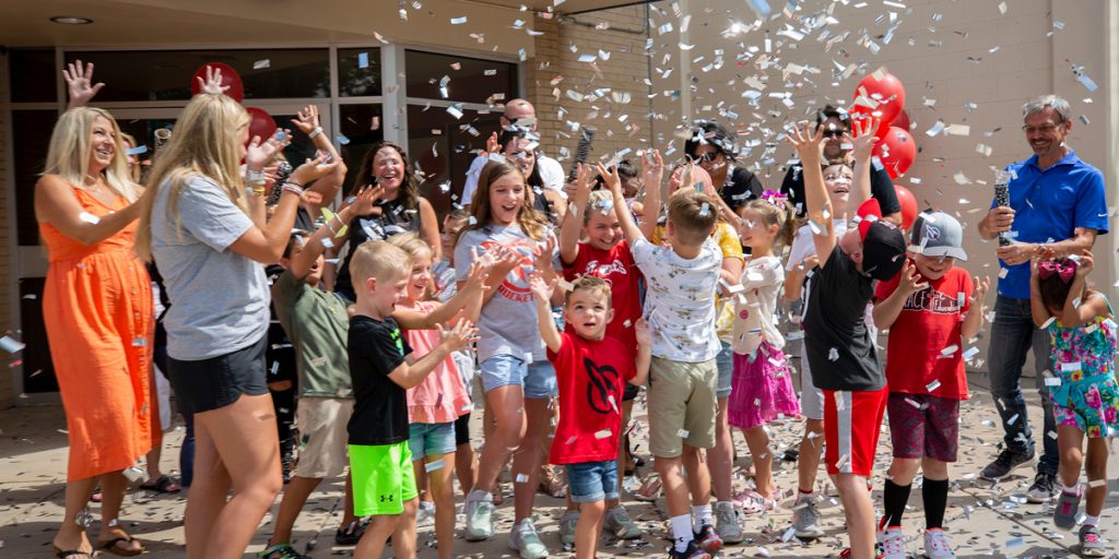 The crowd reaction at the grand makeover reveal at the Shrine of St. Annes School.